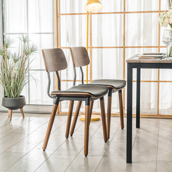 Lot de 2 chaises en bois et simili noir