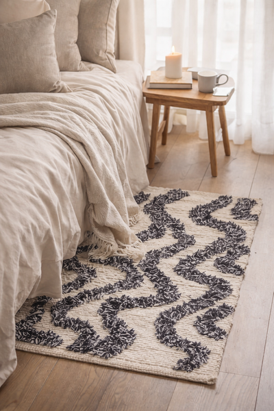 KOUVOLA - Rechthoekig katoenen tapijt met beige en zwarte motieven 60 x 90 cm
